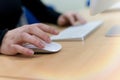 Close up shot of human woman hands using laptop computer, typing, writing, taking note Royalty Free Stock Photo