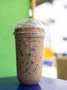 Close-up shot of iced coffee drink in a clear plastic cup. Royalty Free Stock Photo
