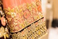 Close-up shot of indian bride female wedding dress,