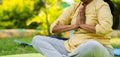 Close up shot of indian senior woman doing namaste or mudra yoga or meditation at park - concept of wellness, Active Royalty Free Stock Photo