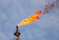 Close-up shot of a Industrial chimney emitting a plume of smoke, illustrating air pollution