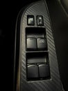 Close up shot inside a car of the buttons panel for controlling the windows and door lock Royalty Free Stock Photo