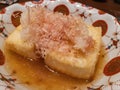 Close up shot of Japanese style deep fried tofu and Bonito flakes