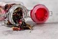 Close up shot of jar and dry scattered rose petals with defocused background