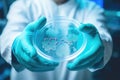 Close-up shot of lab worker holding bacteria dish