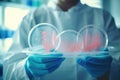 Close-up shot of lab worker holding bacteria dish