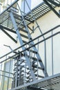 Close up shot of ladder with external fire escape on side of building or house in the city or urban and suburban Royalty Free Stock Photo