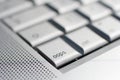 Close up shot of a laptop keyboard with a `oops` key in focus