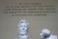 Close-up shot of the Lincoln Memorial statue with inscription in the background in Washington, DC