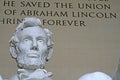 Close-up shot of the Lincoln Memorial statue with inscription in the background in Washington, DC