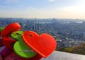 Close up shot of Lock love hanged on the wall with a view of the city of Seoul during Valentines day