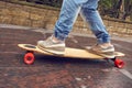 Close up shot longboarder in action Royalty Free Stock Photo
