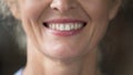 Close up shot lower face view of smiling older female