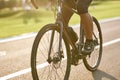 Close up shot of male cyclist legs, man cycling outdoors on a summer day