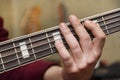 Close Up Shot Of Male Hand Playing Bass Guitar Royalty Free Stock Photo