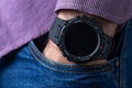 Close up shot of a man hand that uses a smart watch to view incoming messages and calls