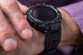 Close up shot of a man hand that uses a smart watch to view incoming messages and calls