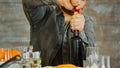 Close up shot of man opening a bottle of red wine Royalty Free Stock Photo