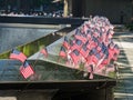 Close up shot of many America flags on the 9/11 Memorial South Pool