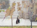 Close up shot of many decoration with a homeless people pass by