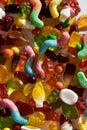 Close up shot of many tasty colorful gummies made from fruit juice, gelatin and sugar