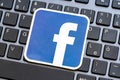 Close-up shot of the Meta Facebook logo symbol on a desktop PC computer keyboard, closeup. Social media, Metaverse, FB and