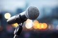 Close-Up Microphone on Stand with Bokeh City Lights Royalty Free Stock Photo