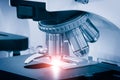 Close-up shot of microscope with metal lens at laboratory Royalty Free Stock Photo