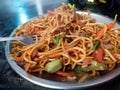 A close up shot of mix vegetable noodles or Chowmein in a road side stall . Dehradun city of Uttarakhand India