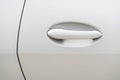 Modern door handle of a white car Royalty Free Stock Photo