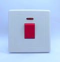 White Electrical Switch with Red Power Button and Indicator Light Royalty Free Stock Photo
