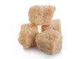 Close-Up shot of natural brown unrefined sugar cubes on white background Royalty Free Stock Photo