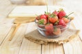 Close up shot of nature fresh strawberry in glass bowl on wooden Royalty Free Stock Photo