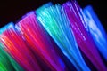 close-up shot of neon-colored toothbrush bristles, freshly moistened