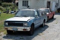 Close-up shot of an old abandoned blue Chevrolet LUV Mikado in sunlight