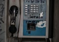 Close-up shot of an old dirty payphone Royalty Free Stock Photo