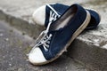 Old dirty ragged holey shabby sneakers