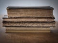 Old stacked books on a wooden table Royalty Free Stock Photo