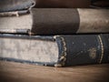 Old stacked books on a wooden table Royalty Free Stock Photo