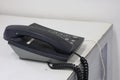 Close-up shot of an old telephone for communicating on an office phone. Royalty Free Stock Photo