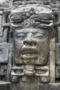 Close up shot of the Olmec stone mask on the Mayan temple of Lamanai in Belize Royalty Free Stock Photo