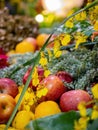 Close up shot of Oncidium flexuosum and apple, oranges