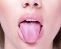 Close up shot of an open mouth and a healthy human tongue Royalty Free Stock Photo