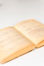 Close up shot of an open old science book containing equations and graphs from different fields: math, physics, chemistry. The