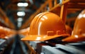Close up shot of orange hard hat on pipe, construction and engineering image