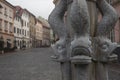 Close-up shot of an ornate stone fountain featuring fish statues in Ljubljana, Slovenia