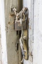 Close-up shot of padlock hanged on the old door