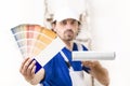 Close up shot of painter man showing a color palette Royalty Free Stock Photo