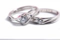 Close up shot of pair engagement /  mariage rings isolated Royalty Free Stock Photo