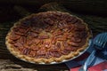 Close up shot of a pecan pie cooling. American classic homemade pecan pie. Amish pies. Napkin a flag of USA. Royalty Free Stock Photo